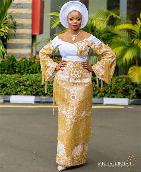 Clipkulture Yoruba Bride In White And Gold Beaded Aso Oke Dress With Tassels And White Gele