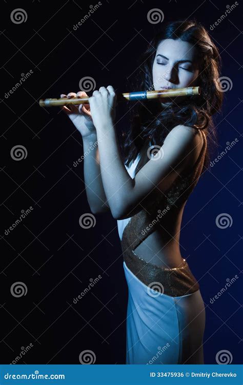 Sensuality Brunette Plays A Wooden Flute Stock Photo Image Of