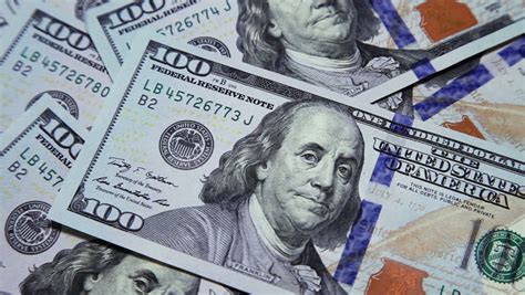 Fotosearch enhanced rf royalty free. American Currency One Hundred Dollar Bills Through A ...