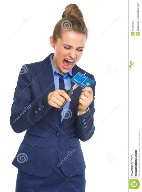 Angry Business Woman Cutting Credit Card With Scissors