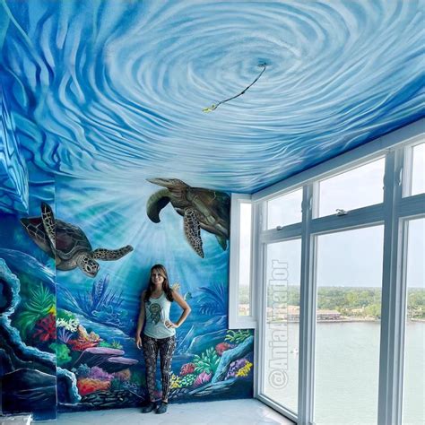 Artist creates immersive mural painting of sea spanning floor to ceiling
