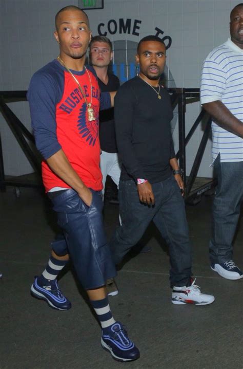 Slim santana is what you can call 'twitter famous'. T.I. rocks a red and blue Hustle Gang shirt | Celebrity ...