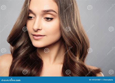 Brunette Girl With Healthy Curly Hair And Natural Make Up Beautiful