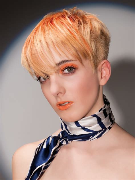 And here we should flag up three main points: Blonde with orange hair with short clipped sides and back