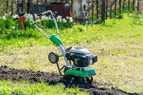 Cultivator For Cultivating The Soil In The Garden Stock Photo Image