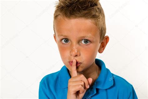 Boy Making Keep Quiet Gesture Stock Photo By ©bigandt 52896119