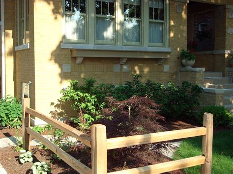 This fence style naturally creates planting opportunities where taller ornamental trees can be centered and surrounded by repeating clusters of similar plants. bungalow, custom, windowbox, split rail fence, urban ...