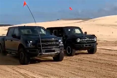 Drag Race New Ford Bronco Vs F 150 Raptor In The Sand Carbuzz