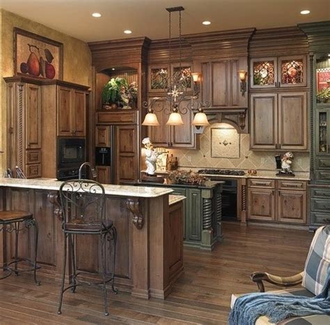The drawers and cabinet looks harmonious with the same color scheme. 40 Rustic Kitchen Designs to Bring Country Life -DesignBump