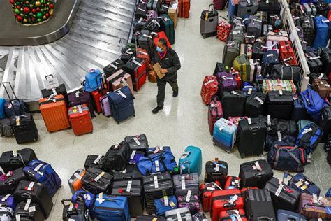 Massive Flight Cancellations Leave Hundreds Of Suitcases Stranded At Us