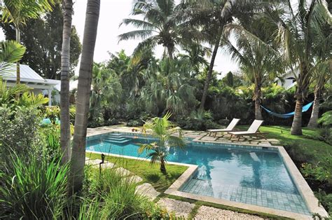 Having a pool in the backyard is a huge advantage to any home. Key West Pool & Tropical Garden - Landscaping Network