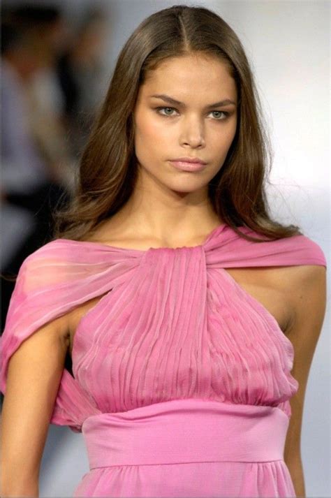 A Model Walks Down The Runway Wearing A Pink Dress With One Shoulder