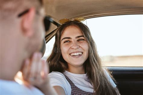 Couple On A Road Trip Love And Care Travel In Car With Smile And Woman