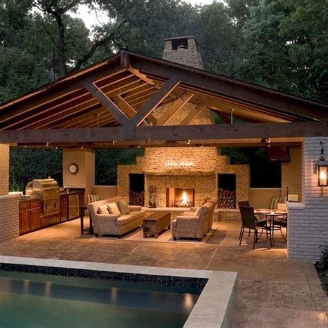 An Outdoor Living Area Next To A Swimming Pool With Furniture And