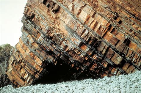 This form of ownership is the first strata title was introduced by the australian state of new south wales in 1961. Dipping rock strata - Stock Image - E415/0327 - Science ...