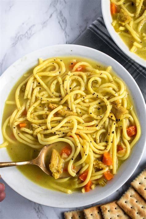Slowly cooking a whole chicken, fragrant herbs, and fresh vegetables in chicken broth rather than water imparts a rich flavor to this soup. Vegan Chicken Noodle Soup 1 - Plant Power Couple