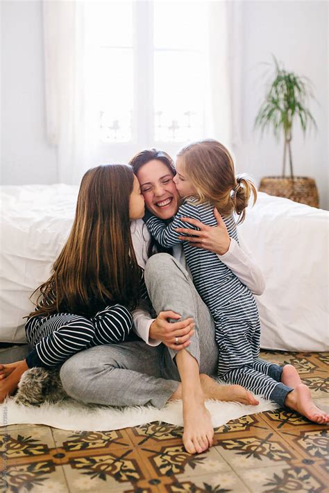 Mom And Her Babes Kissing And Hugging In The Morning At Home By Stocksy Contributor