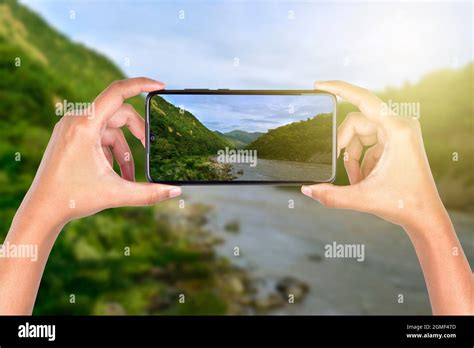 Taking Landscape Pictures From Smartphone Stock Photo Alamy