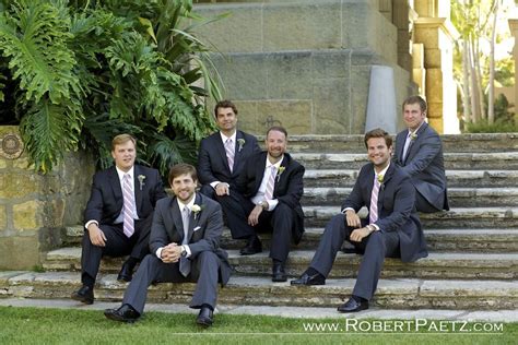 Groomsmen Sitting On Low Stairs Santa Barbara Courthouse Wedding