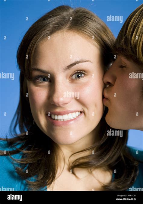 Closeup Of Boy Kissing Girl On Cheek Stock Photo Alamy