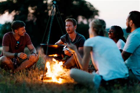 Best Friends Camping Together In Nature Stock Photo Download Image