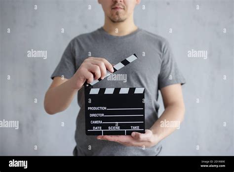 Videography And Filmmaking Concept Young Man Holding Clapper Board In