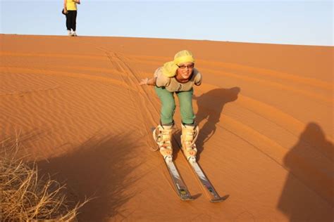 B camel ridinq in morocco see all of southern morocco on a camell take your time and enjoy a relaxing journey from marrakech with historic sites across the desert to the dades gorge. Sand Skiing as the Sunsets in the Sahara Desert