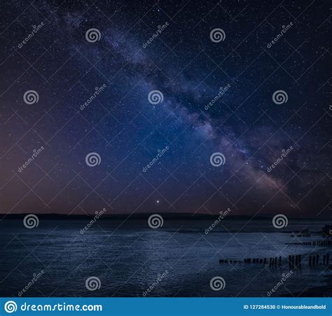 Vibrant Milky Way Composite Image Over Landscape Of Beautiful Se Stock