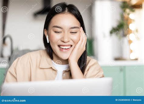 Portrait Of Happy Asian Girl Talks On Video Chat Communicating With Laptop Application