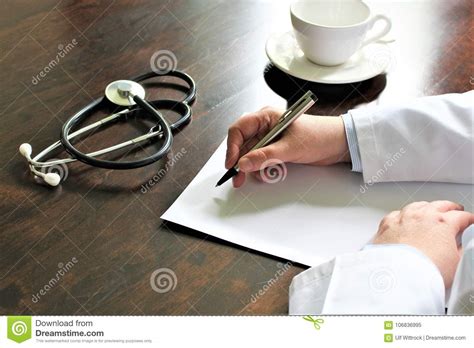 An Image Of A Writing Doctor With Stethoscope Stock Image Image Of