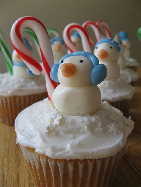 Discover 37 easy and/or diy christmas decorations, including wreaths, advent calendars, ornaments, and more! 'Snowman' with earmuffs and candy cane cupcake icing ...