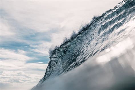 Perfect Barrel Wave In Ocean Breaking Wave With Sun Light Stock Image