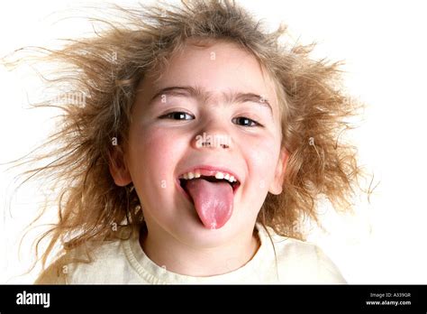 Young Girl Sticking Her Tongue Out Model Released Stock Photo Alamy