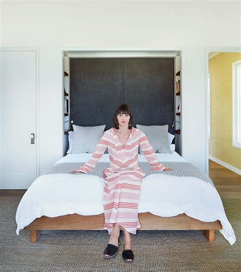 Portrait Of Woman Relaxing In Bedroom By Stocksy Contributor