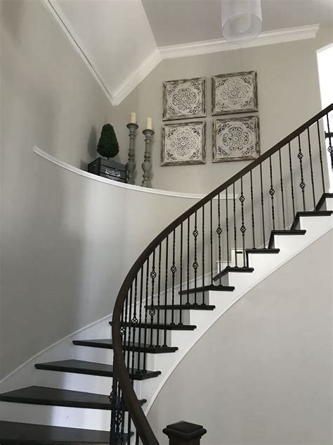 Here we run down the. Decorate large high ceiling curved stairs shelf large ...