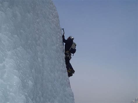 Hd Wallpaper Man Climbing A Snow Covered Mountain Ice Climbing