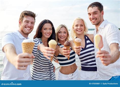 Smiling Friends Eating Ice Cream On Beach Stock Photo Image 47830881