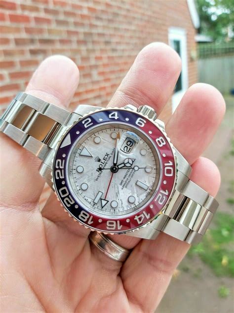 If you can do without white gold and a meteorite dial, rolex also offers a technically identical. Rolex GMT Master II 126719BLRO, White Gold Meteorite Dial ...