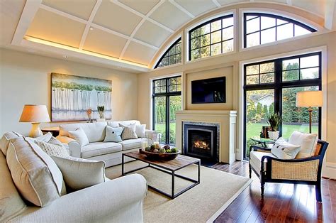 When you think of a living room with a fireplace, the image that comes to your mind is a room with some cozy chairs placed around a stone fireplace which keeps the room warm. TV Above Fireplace Design Ideas