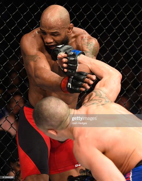 Robert Whittaker Of New Zealand Punches Yoel Romero Of Cuba In Their