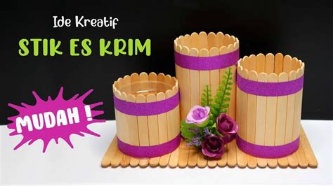 There Is A Cake Made To Look Like Wooden Barrels With Flowers On The