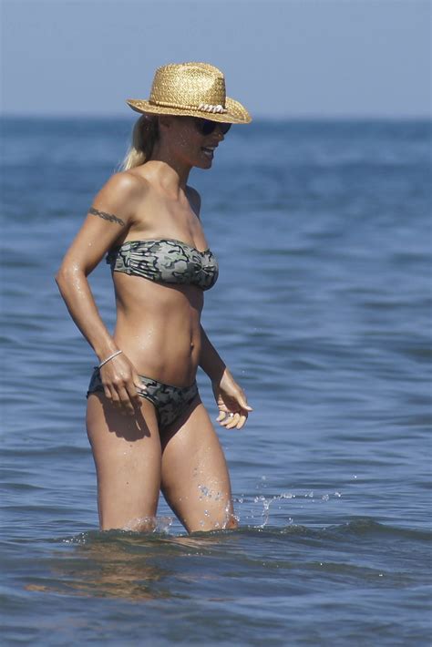 Michelle Hunziker In Bikini At A Beach In Italy Hawtcelebs
