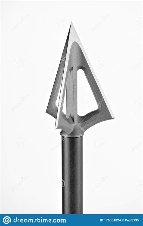 The Tip Of A Hunting Arrow A Close Up Against A White Background Stock