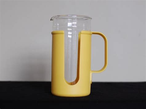 Vintage Pyrex Glass Pitcher In Corning Plastic Handled Sleeve