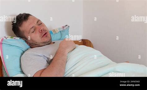 Sick Man Lying On Bed And Coughing A Lot Stock Video Footage Alamy