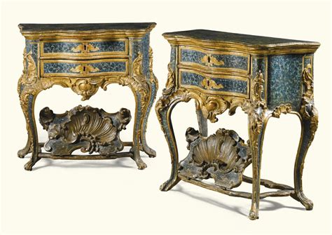 76 A Pair Of Italian Lacquered And Parcel Gilt Carved Commodes