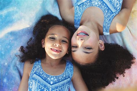 Young Sisters Laying On A Blanket By Stocksy Contributor Chelsea Victoria Stocksy