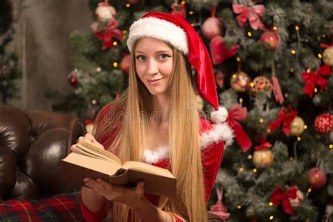 beautiful model dressed as santa with near a christmas tree stock image image of fashion