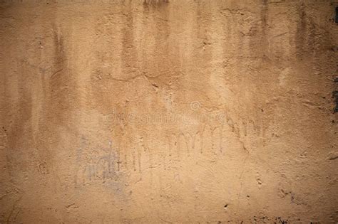 Texture Of Old Rustic Wall Covered With Yellow Stucco Stock Photo