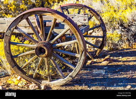 Vintage Wooden Wagon Wheels With Iron Rims In Early Morning Light Stock